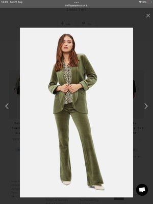 Green velvet cord flare trousers